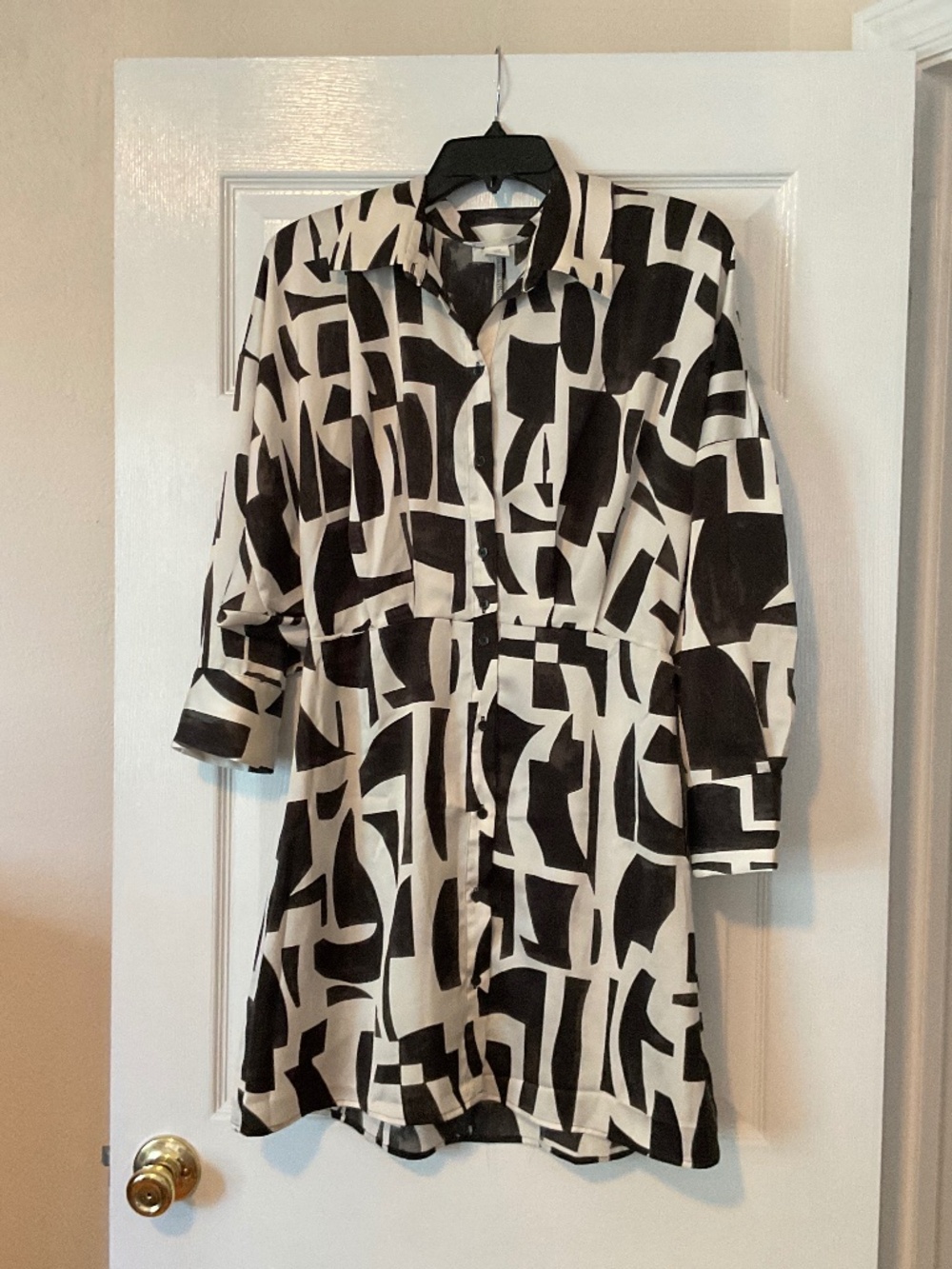 Ladies H&M size medium black and white button up shirt dress.